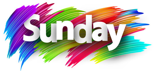 Sunday paper word sign with colorful spectrum paint brush strokes over white.