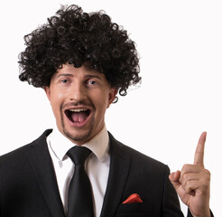young man feeling like a happy and excited genius after realizing an idea, cheerfully raising...