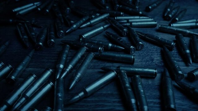 Passing Bullets On Table In Dark Room
