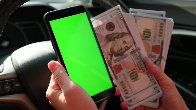 phone in hand, green screen mobile phone at car 