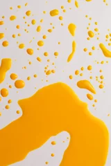 Rolgordijnen Ink Watercolor flow blot drops splash. Abstract texture Yellow orange color stain background. © Liliia