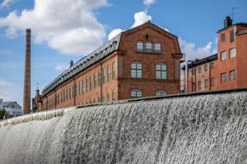 Motala river and the old industrial landscape during summer. Norrköping is a historic industrial town in Sweden.