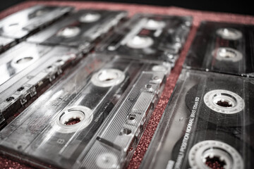 Retro Audio Nostalgia: Close-Up Shot of Colorful Cassettes on Red