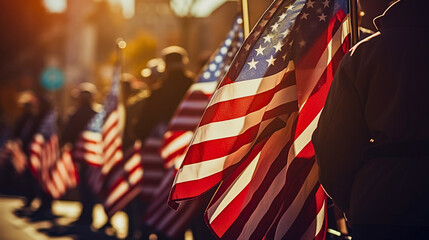 In mid-morning sunlight, a Veterans Day parade with American flags, and uniformed military veterans showcases patriotic spirit and unity, highlighting their determination.