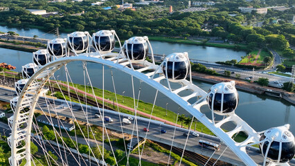 Sao Paulo Brazil. Major Ferris Wheel  Entertainment of Latin America at downtown Sao Paulo Brazil. Ferris wheel at amusement park. Entertainment attraction scenery. Villa Lobos Park. Tourism landmark.