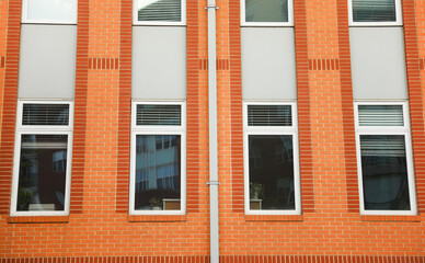 skyscraper in a bustling city, symbolizing innovation and growth in the modern commercial real estate industry. Dynamic, glassy exterior reflects urban vitality