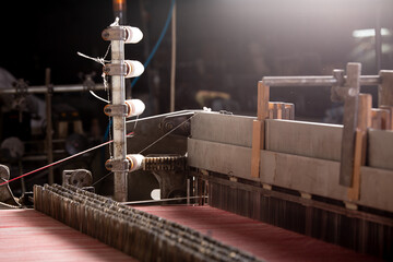 Production line of the silk thread in a textile factory. Industrial background