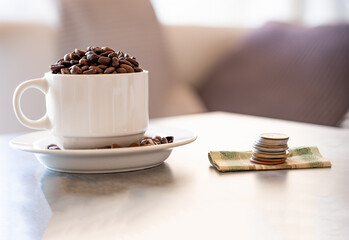 Money with coffee cup background  in living room  on grey living room table