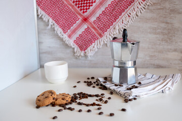 Coffee set of espresso boiler with grounded and beans of coffee on white background with arabick shmagh