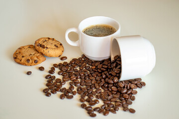 Cup of coffee and coffee drink with cookies on white background