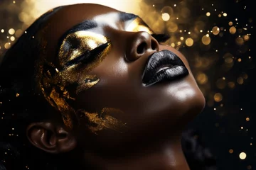 Model with gold glitter on her face. Creative portrait with selective focus and copy space © top images