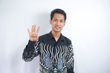 Fototapeta premium Young handsome man over isolated background showing and pointing up with finger number four while smiling confident and happy.
