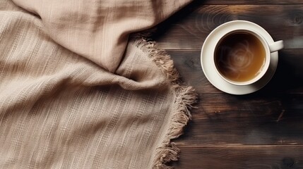 A cup of hot coffee on an old wooden table, seen from above with empty space as a background for words or promotional items. Perfect for winter themed designs, coffee shops and relaxation designs. - obrazy, fototapety, plakaty