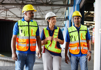 factory workers walking and talking about work or project in the warehouse storage