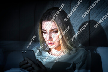 Woman reading negative news in bed at night. Words Doomscrolling flowing out of mobile phone