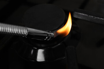 Lighting stove with gas lighter, closeup view