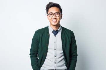 Lifestyle portrait photography of a Vietnamese man in his 20s against a white background