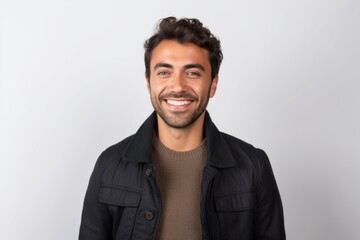 Medium shot portrait photography of a tender Peruvian man in his 30s against a white background