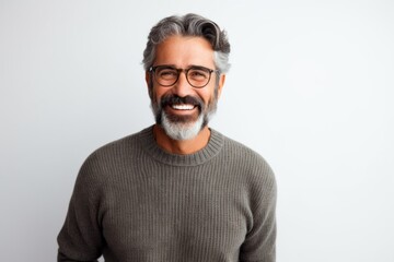 Lifestyle portrait photography of a Peruvian man in his 50s against a white background