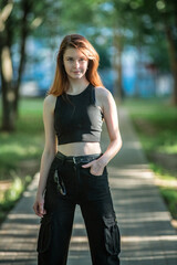 Portrait of a young beautiful long-haired girl in an urban environment.