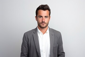 Medium shot portrait photography of a tender French man in his 30s against a white background