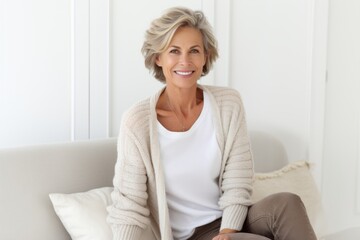 Fototapeta premium Group portrait photography of a French woman in her 50s against a white background