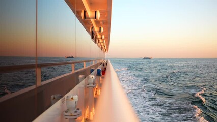 Reflection of the sea in the yacht window at sunset