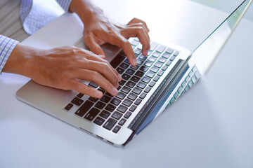 Fototapeta na wymiar Man Typing on Laptop Keyboard, Creative Blog Writing Concept 