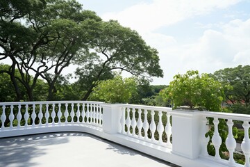 A rooftop balcony with white railings and lush trees in the foreground. Generative AI