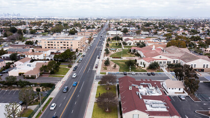 South Gate, California, USA - February 11, 2023: Traffic passes through the urban core of South Gate.