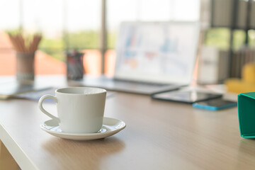 white coffee cup on working table
