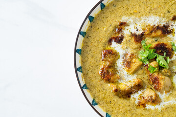 Afghani chicken in green curry or Hariyali tikka chicken hara masala