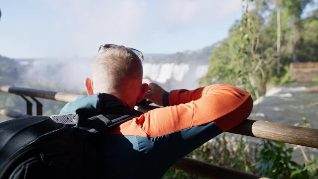 Man Capturing Pictures Of Waterfalls