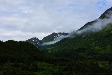 Forest covered mountain range outside Anchorage, Alaska. Beautiful scenery for hiking and tourism.