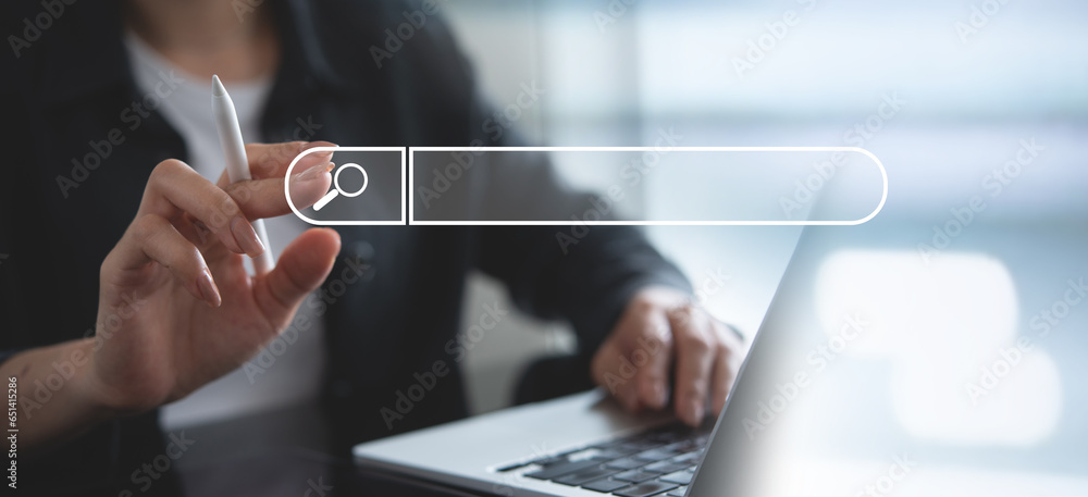 Aufkleber data search technology seo search engine optimization concept. woman's hands typing on laptop comput