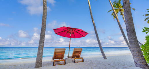 Amazing beach. Romantic chairs umbrella on sandy beach palm leaves, sun sea sky. Summer holiday, couples vacation. Love happy tropical landscape. Tranquil island coast relax beautiful landscape design