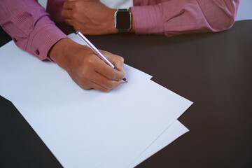 Man Holds a Pen and Ready to Write on Sheets of Paper, Writing Letter Concept

