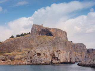 Rhodes, Greece. Lindos small whitewashed village and the Acropolis, scenery of Rhodos Island at Aegean Sea. St. Pauls bay