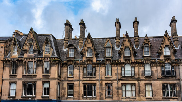 Stone houses with the typical architecture of the monumental city of Edinburgh, Scotland.