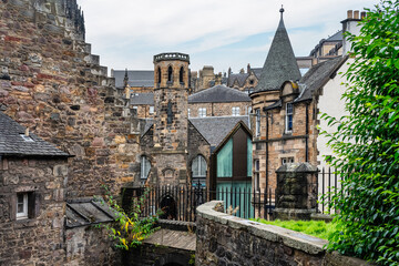 Greyfriars medieval cemetery located in the centre of Edinburgh next to historic buildings,...