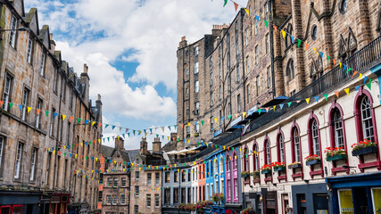 Victoria Street with its medieval houses and shops with brightly colored facades, Edinburgh,...