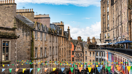 Victoria Street in downtown Edinburgh decorated with flags for the August party, Scotland.