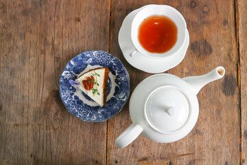 hot tea, tea cup and tea pot and carrot cake