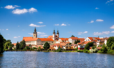 Fototapeta na wymiar View towards the Castle of Telc in the Czech Republic, with the Name of Jesus Church