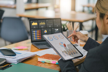 Advisor financial business analytics woman analyzing data charts, graphs, and a dashboard on laptop...