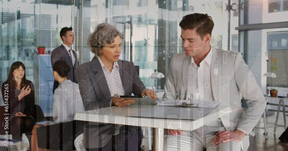 Poster animation of multiple graphs, numbers over caucasian coworkers discussing reports on digital tablet