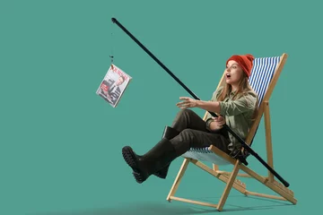 Foto op Canvas Surprised young woman with fishing rod and magazine on green background © Pixel-Shot