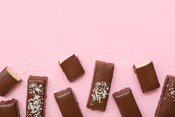 Tasty chocolate covered coconut candies on pink background - obrazy, fototapety, plakaty