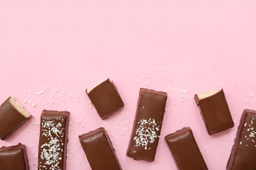Foto op Plexiglas Tasty chocolate covered coconut candies on pink background © Pixel-Shot