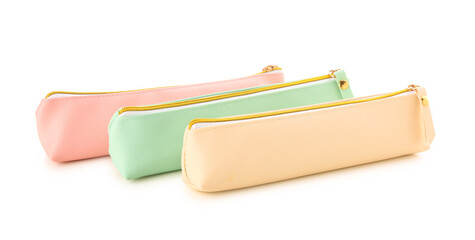 Pencil cases on white background